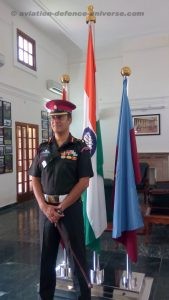 Col Dheeraj Chengappa Commanding Officer Of  Indian Army's President's Body Guard at his office in Rashtrapati Bhawan. Behind him are the Indian and PBG flags.