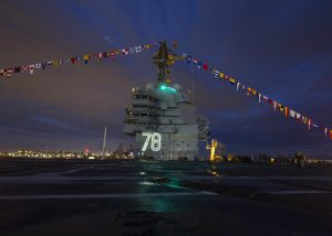 US Navy's to be commissioned aircraft carrier USS Gerald R Ford all lit up and decorated at its pre-commissioning during the US Independence Day on 4th July.The ship will get commissioned on July22 2017 at Naval Station Norfolk. This ship has advances in technology such as a new reactor plant, propulsion system, electric plant, Electromagnetic Aircraft Launch System (EMALS), Advanced Arresting Gear (AAG), machinery control, Dual Band Radar and integrated warfare systems. 