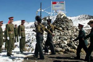 Indian troops marching towards the Chinese troops. The Indian Commander is visible walking behind the troops. The occasion is probably a Border Commanders' Meet.