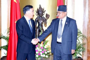 ice Premier of the State Council of the People's Republic of China, Wang Yang (left), and Nepal's Deputy Prime Minister Bijaya Kumar Gachhadar, shake hands during the signing ceremony of three important agreements in Kathmandu. 