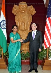 The Union Minister for Defence, Nirmala Sitharaman  shaking hands with  the US Secretary of Defence, James Mattis. infront of the Ashok Pillar in South Block. Both Indian and National flags are in the background.