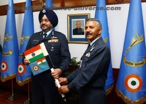 The Chief of the Air Staff, Air Chief Marshal B.S. Dhanoa receiving the ice-axe baton with Indian and Air Force Flag from Group Captain R.C. Tripathi VM