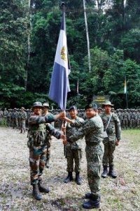 Regimental flag of GRENADIERS being handed back to Col SN Karthikeyan