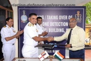 Commodore Deepak Kumar, Chief Staff Officer (Operations) receiving  keys of CDR building from Dr Pradhan.