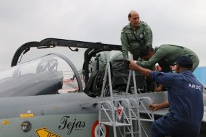 The Union Minister for Defence, Shri Rajnath Singh after his maiden sortie in LCA Tejas with Air Vice Marshal Narmdeshwar Tiwari, at HAL Airport,