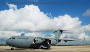 A high-wing, 4-engine, T-tailed military-transport aircraft