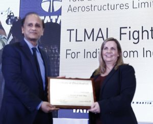 Sukaran Singh receiving the certification from Aimee Burnette