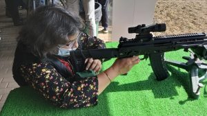 Author Sangeeta Saxena checking the AK-203 at Army 2021