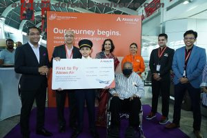 Mr. Vinay Dube, holding the symbolic boarding