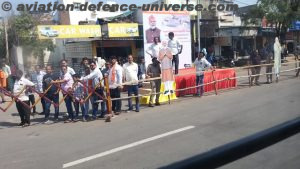 roadsides are thronged by people waiting to get a glimpse of the Prime Minister